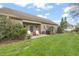 Well-maintained backyard with patio, seating, and ample green space for outdoor enjoyment at 8437 Little Woody Ct, Zebulon, NC 27597