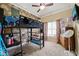 This bedroom features a loft bed, floral wallpaper, neutral walls, and neutral carpeted floor at 8437 Little Woody Ct, Zebulon, NC 27597