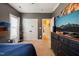 This bedroom features gray walls, carpeted floors, and access to closets and hallway at 8437 Little Woody Ct, Zebulon, NC 27597
