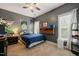 This bedroom features grey walls, carpeted floors, and a ceiling fan with an integrated light at 8437 Little Woody Ct, Zebulon, NC 27597