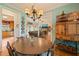 Charming dining room with hardwood floors, a round table, and views into the living room at 8437 Little Woody Ct, Zebulon, NC 27597