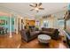 Open-concept living room boasts hardwood floors and seamless transitions to the kitchen and dining areas at 8437 Little Woody Ct, Zebulon, NC 27597