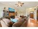Inviting living room featuring a fireplace, built-in shelving, and hardwood floors at 8437 Little Woody Ct, Zebulon, NC 27597