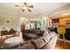 Spacious living room featuring hardwood floors, ceiling fan and an open layout at 8437 Little Woody Ct, Zebulon, NC 27597