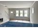 Bright living room features natural light with large windows and an inviting staircase at 905 Linwood Ave, Durham, NC 27701