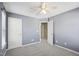 Bedroom featuring carpet floor, ceiling fan, and multiple white doors at 912 Ambergate Sta, Apex, NC 27502