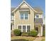 Charming townhome with manicured landscaping, a covered entrance, and a blend of modern and traditional design elements at 912 Ambergate Sta, Apex, NC 27502