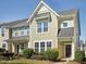 Charming townhome with manicured landscaping, a covered entrance, and a blend of modern and traditional design elements at 912 Ambergate Sta, Apex, NC 27502