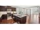 Kitchen showcasing an island with sink, stainless steel appliances, and eat-in breakfast area at 912 Ambergate Sta, Apex, NC 27502