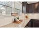 Close up view of kitchen countertop featuring granite counter, subway tile, and white cabinets at 912 Ambergate Sta, Apex, NC 27502
