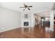 Spacious living room with a fireplace, hardwood floors, and an open layout with easy access to the kitchen at 912 Ambergate Sta, Apex, NC 27502