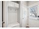 Mudroom with white hall tree and coat rack adjacent to a door with a window at 912 Ambergate Sta, Apex, NC 27502