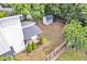 Aerial view of a home highlighting the landscaped backyard, outdoor patio, and storage shed at 915 S State St, Raleigh, NC 27601