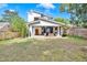 Well-manicured backyard with patio, outdoor seating, lush green lawn, and modern architectural details at 915 S State St, Raleigh, NC 27601