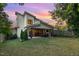 Stunning backyard featuring covered patio with fireplace and spacious lawn at 915 S State St, Raleigh, NC 27601