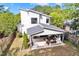 Aerial view of backyard featuring covered patio with outdoor seating and fireplace at 915 S State St, Raleigh, NC 27601