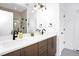 Modern bathroom with double vanity, stone countertops, and large mirror at 915 S State St, Raleigh, NC 27601
