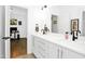 Bright bathroom features dual sinks, quartz countertops, modern fixtures, and ample storage space at 915 S State St, Raleigh, NC 27601