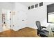 Bright bedroom features wood floors, minimalist decor, and natural light, perfect for a modern living space at 915 S State St, Raleigh, NC 27601