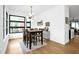 A bright dining room featuring modern lighting, stylish decor, and a dining set for six at 915 S State St, Raleigh, NC 27601
