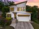 Beautiful two-story home with a modern design, striking windows, and a well-manicured lawn at 915 S State St, Raleigh, NC 27601