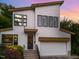 Modern exterior with a two-car garage, unique design, and well-manicured landscaping at 915 S State St, Raleigh, NC 27601