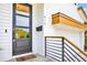 Close-up of modern front door with a glass pane, secure lock, and welcoming 'oh hello' doormat at 915 S State St, Raleigh, NC 27601