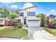 Charming two-story home featuring modern architectural design, landscaped yard, and inviting curb appeal at 915 S State St, Raleigh, NC 27601