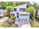 Lovely two-story home with modern design, striking windows, and a well-manicured lawn and garden at 915 S State St, Raleigh, NC 27601