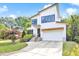 Charming two-story home featuring modern architectural design, landscaped yard, and an attached garage at 915 S State St, Raleigh, NC 27601