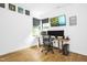 Home office with wood floor, large window, and modern computer setup at 915 S State St, Raleigh, NC 27601