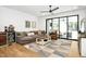 Cozy living room featuring a comfortable couch, accent chairs, and a large sliding glass door at 915 S State St, Raleigh, NC 27601