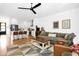 Living room featuring a kitchen view, hardwood floors, and a comfortable couch with coffee table at 915 S State St, Raleigh, NC 27601