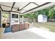 Covered patio with comfortable seating, an outdoor fireplace, and a ceiling fan for relaxed outdoor living at 915 S State St, Raleigh, NC 27601