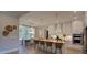 Modern kitchen with white cabinets, a central island with seating, and stainless-steel appliances offering form and function at 97 August Trace Dr, Pittsboro, NC 27312