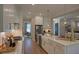 Stylish kitchen with abundant cabinetry, farmhouse sink, and stainless appliances, offering a chef's dream workspace at 97 August Trace Dr, Pittsboro, NC 27312