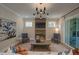 Comfortable living room with modern lighting, stylish decor and large sliding glass doors at 97 August Trace Dr, Pittsboro, NC 27312