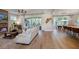 Open-concept living room featuring hardwood floors, fireplace, and natural light, perfect for entertaining and relaxation at 97 August Trace Dr, Pittsboro, NC 27312