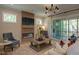 Inviting living room features a cozy fireplace, stylish decor, and comfortable seating for relaxing with Gathering and friends at 97 August Trace Dr, Pittsboro, NC 27312