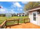Exterior view of the backyard with a barn and other sheds, as seen from the wooden deck at 97 Bailey Rd, Coats, NC 27521
