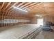 Vast barn interior with exposed beams and ample storage space ready for use at 97 Bailey Rd, Coats, NC 27521