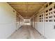 Interior view of the barn featuring multiple stalls with lighting at 97 Bailey Rd, Coats, NC 27521