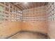 Close-up of an empty barn stall, revealing wooden walls and a concrete floor at 97 Bailey Rd, Coats, NC 27521