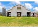 Spacious barn exterior with a white facade, offering ample storage, parking, and shelter at 97 Bailey Rd, Coats, NC 27521