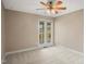 Neutral bedroom featuring lots of natural light from large windows and ceiling fan at 97 Bailey Rd, Coats, NC 27521