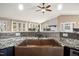 Close up of a copper sink, granite countertops, and a mosaic backsplash in the kitchen at 97 Bailey Rd, Coats, NC 27521