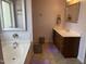 Bathroom featuring a bathtub and vanity with warm paint color and bath mats at 10 Sapphire Dr, Sanford, NC 27332