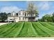 Beautiful two-story home featuring a well-maintained lawn and inviting curb appeal at 10 Sapphire Dr, Sanford, NC 27332