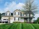 Charming two-story home with a well-manicured lawn and inviting curb appeal at 10 Sapphire Dr, Sanford, NC 27332