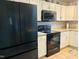 Kitchen with black refrigerator and oven at 10 Sapphire Dr, Sanford, NC 27332
